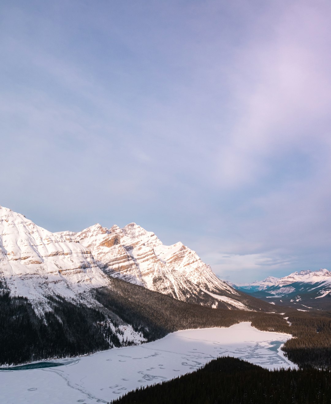 snow covered mountain under cloudy sky during daytime