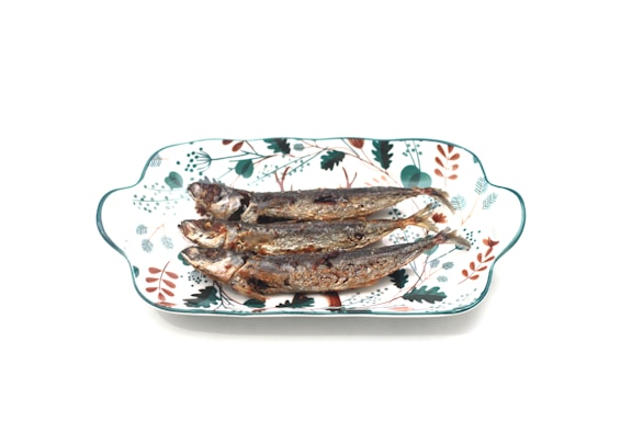 An appetizing display of grilled fish and sides.