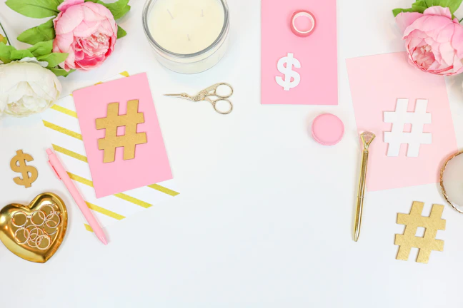 Flat lay of the three co-ord sets arranged with delicate gold accents on an ivory surface.