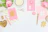 A stylish flat lay of an elegant party kit with soft pastel tones and delicate decorations on a clean white background.