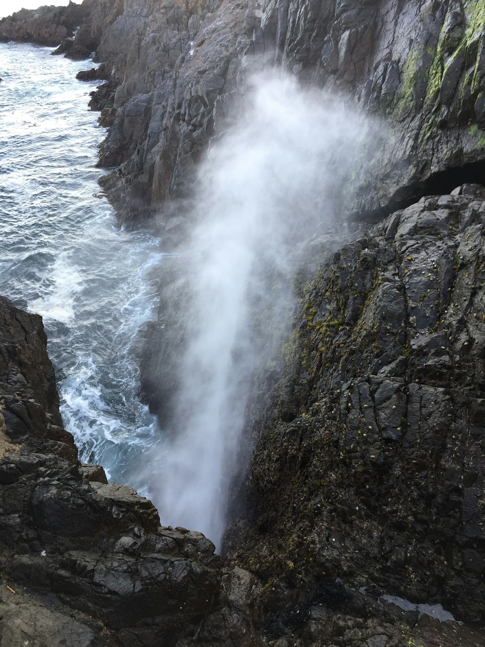 water falls on rocky mountain