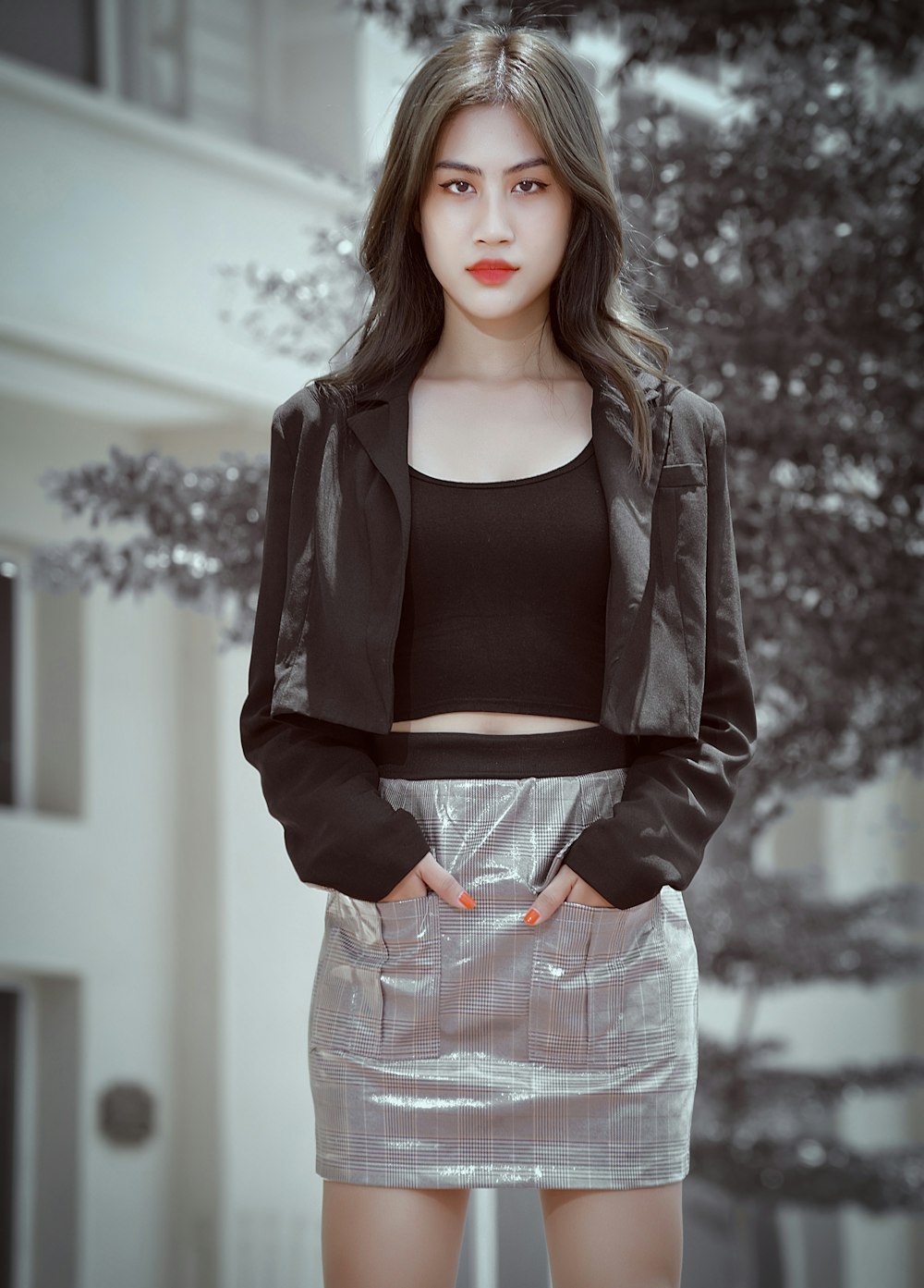 woman in black long sleeve shirt and gray skirt