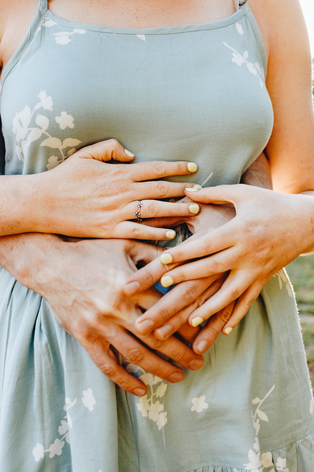 woman in white floral dress with silver ring