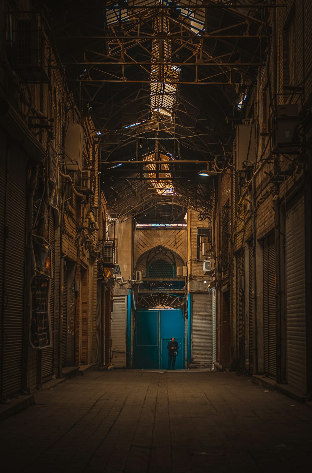 blue wooden door in brown brick building