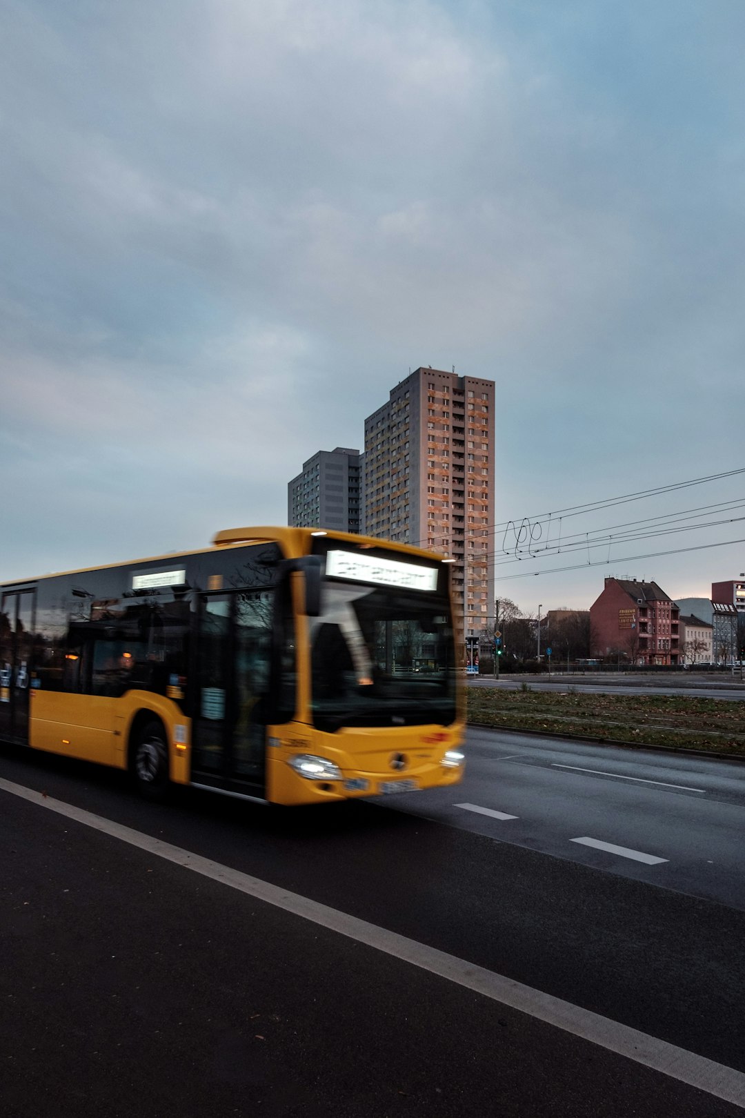 yellow bus on road during daytime