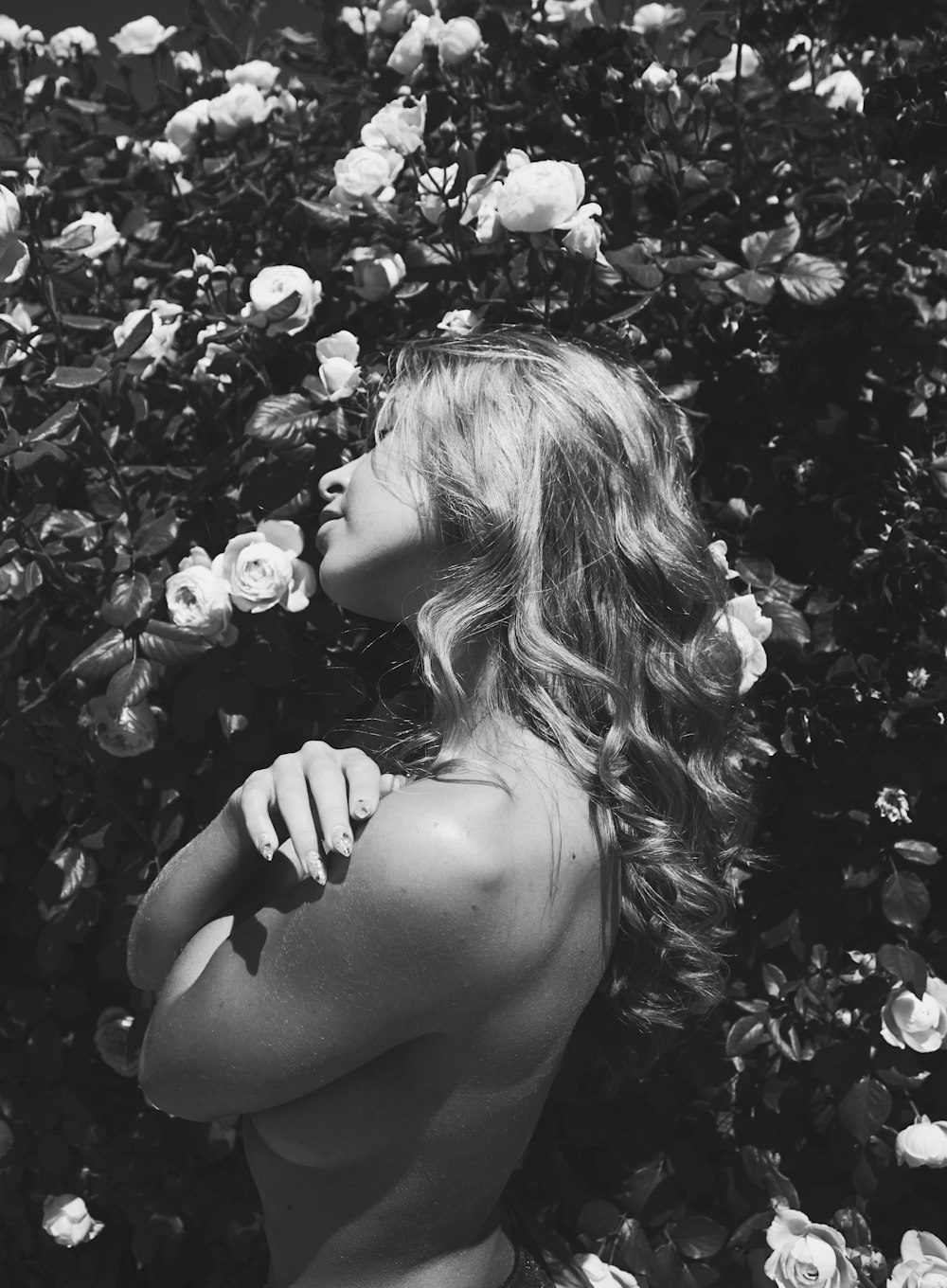 grayscale photo of woman in black brassiere