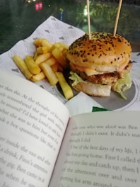 Close-up of a sizzling burger wrapped in branded emo fast food paper, steam rising.