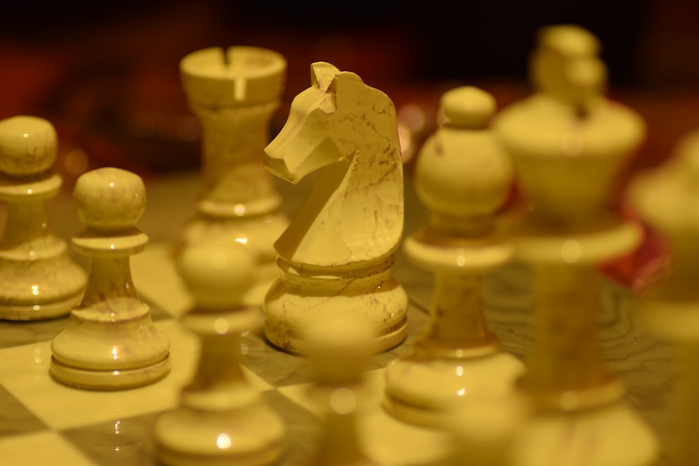 white ceramic chess piece on white chess piece