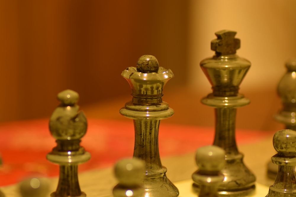 stainless steel chess piece on white table