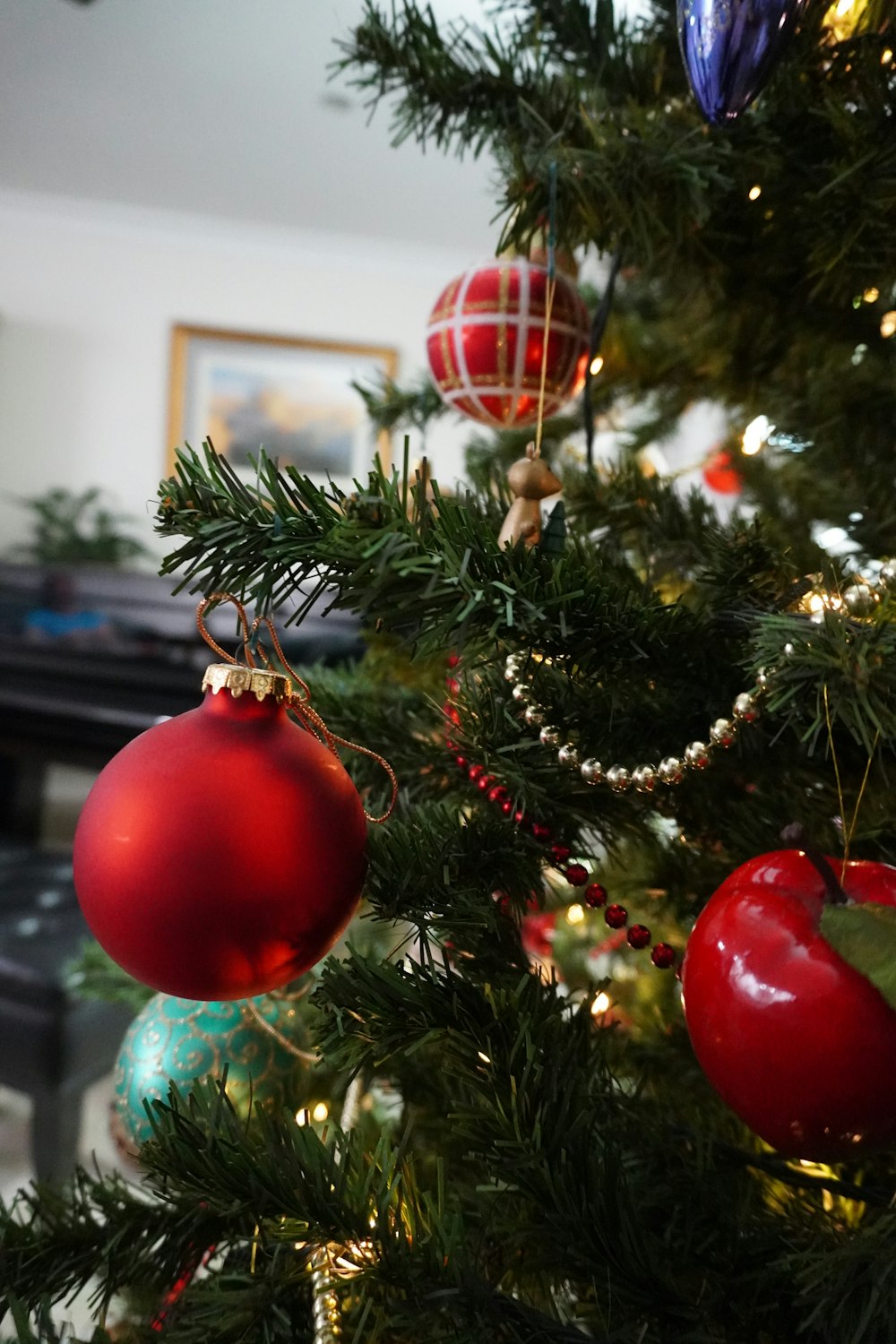 red baubles on green christmas tree