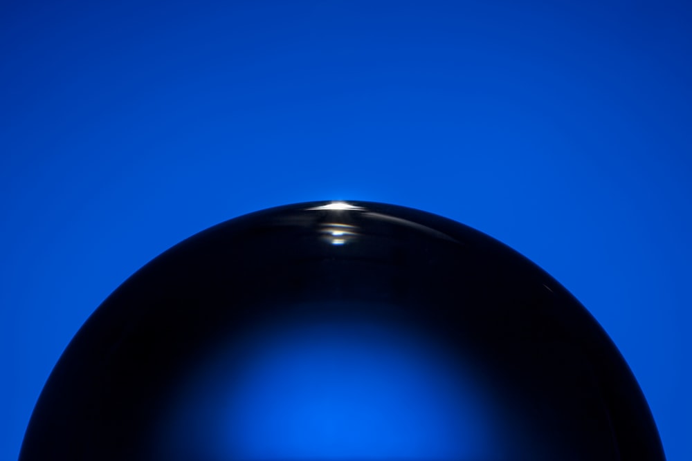 black ball on blue sky