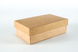 brown cardboard box on white surface
