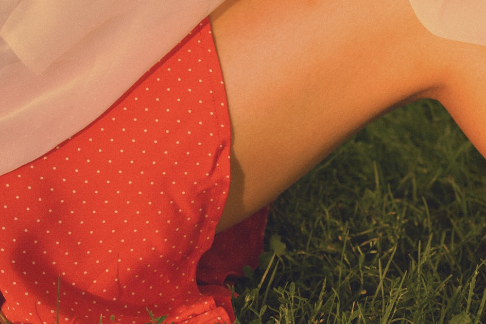 person in red and white polka dot shorts