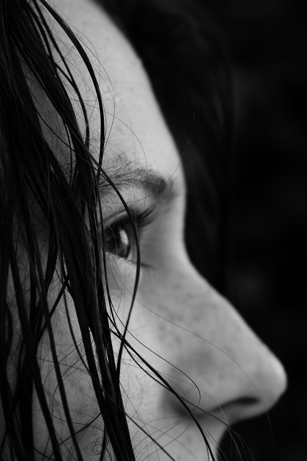 grayscale photo of womans face