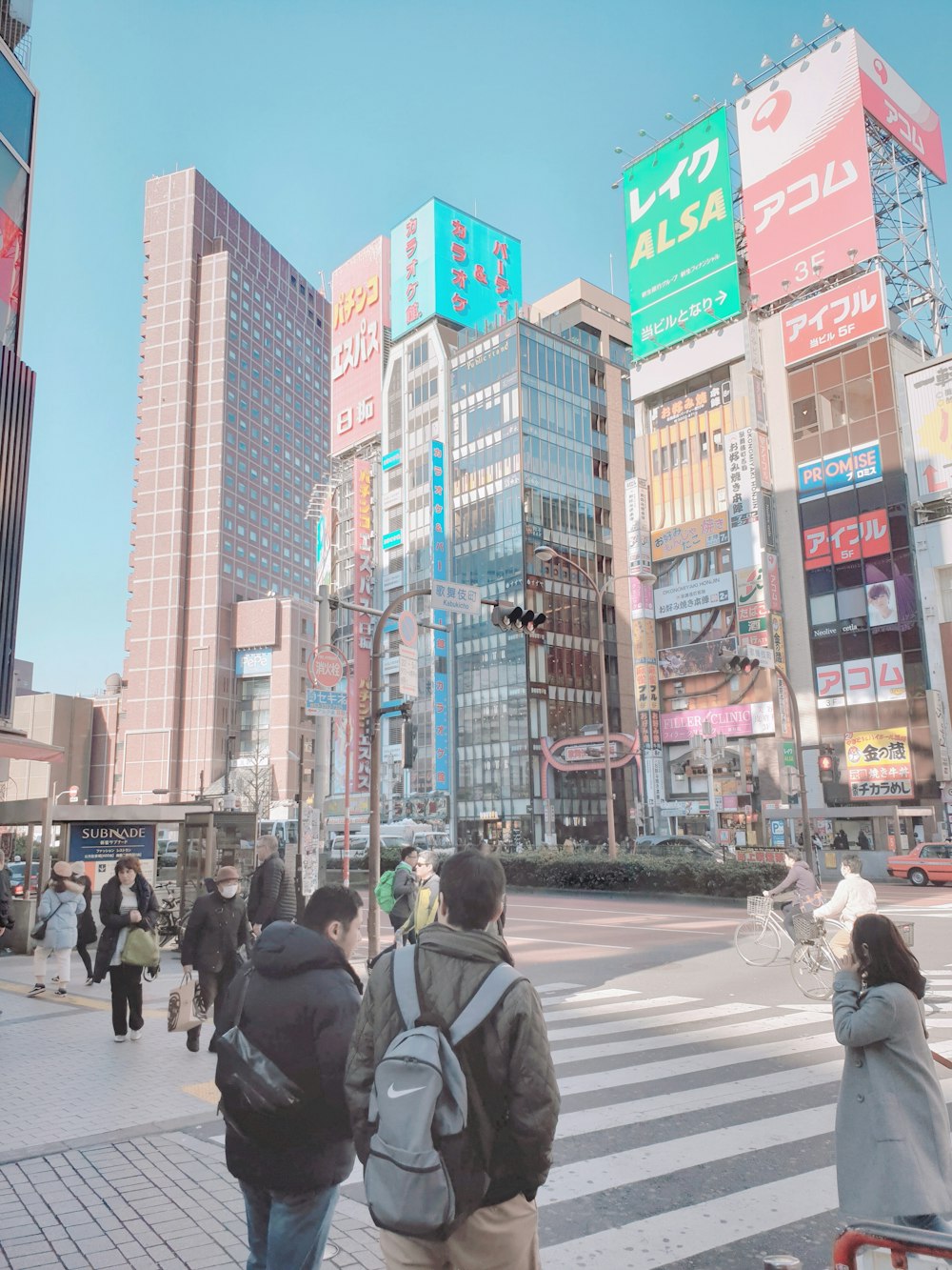 people walking on pedestrian lane during daytime