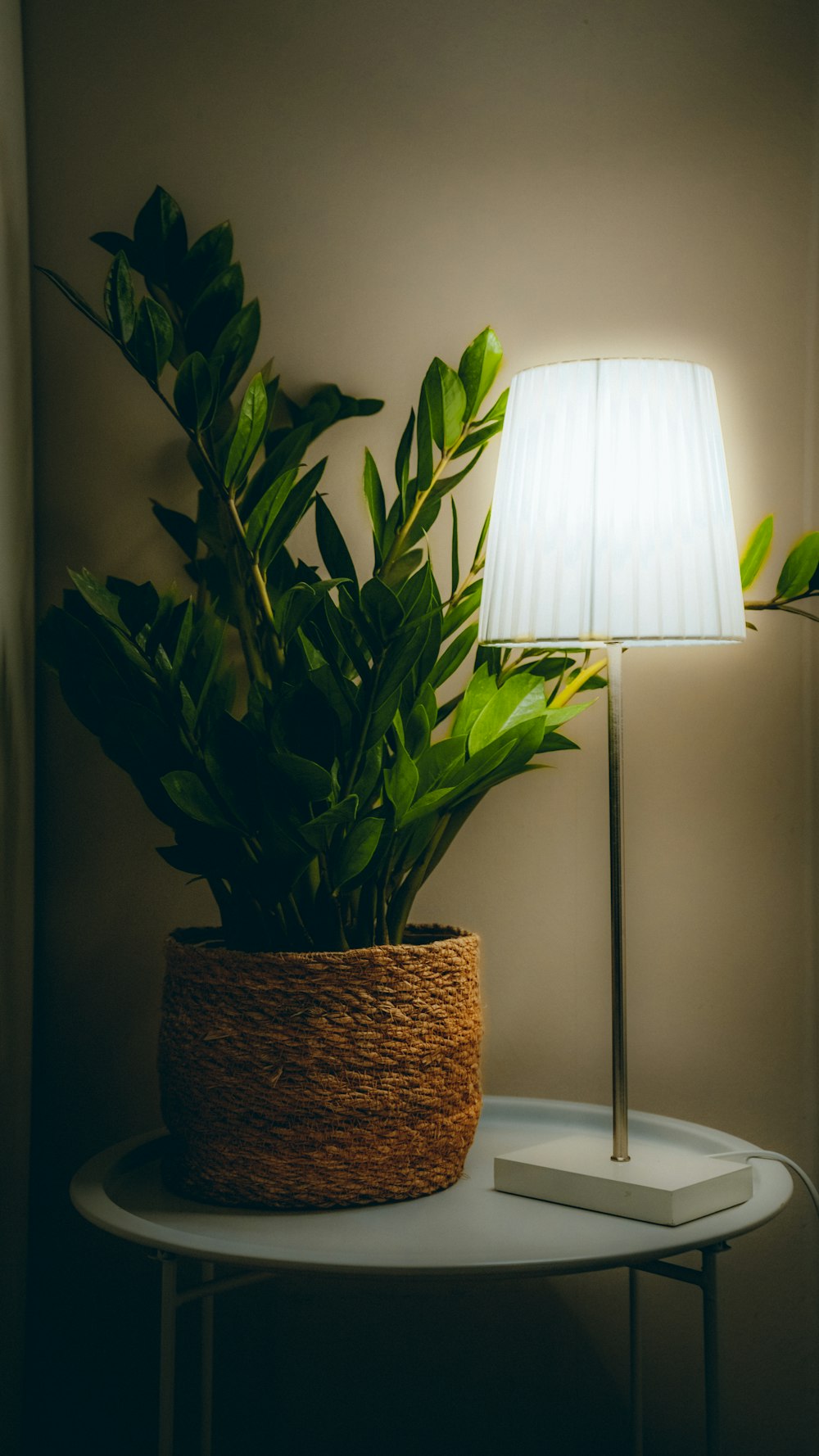 white table lamp on brown woven basket