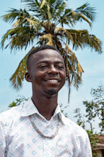 Portrait of Alberto Garcia-Santiago smiling in front of a luxury Punta Cana property.