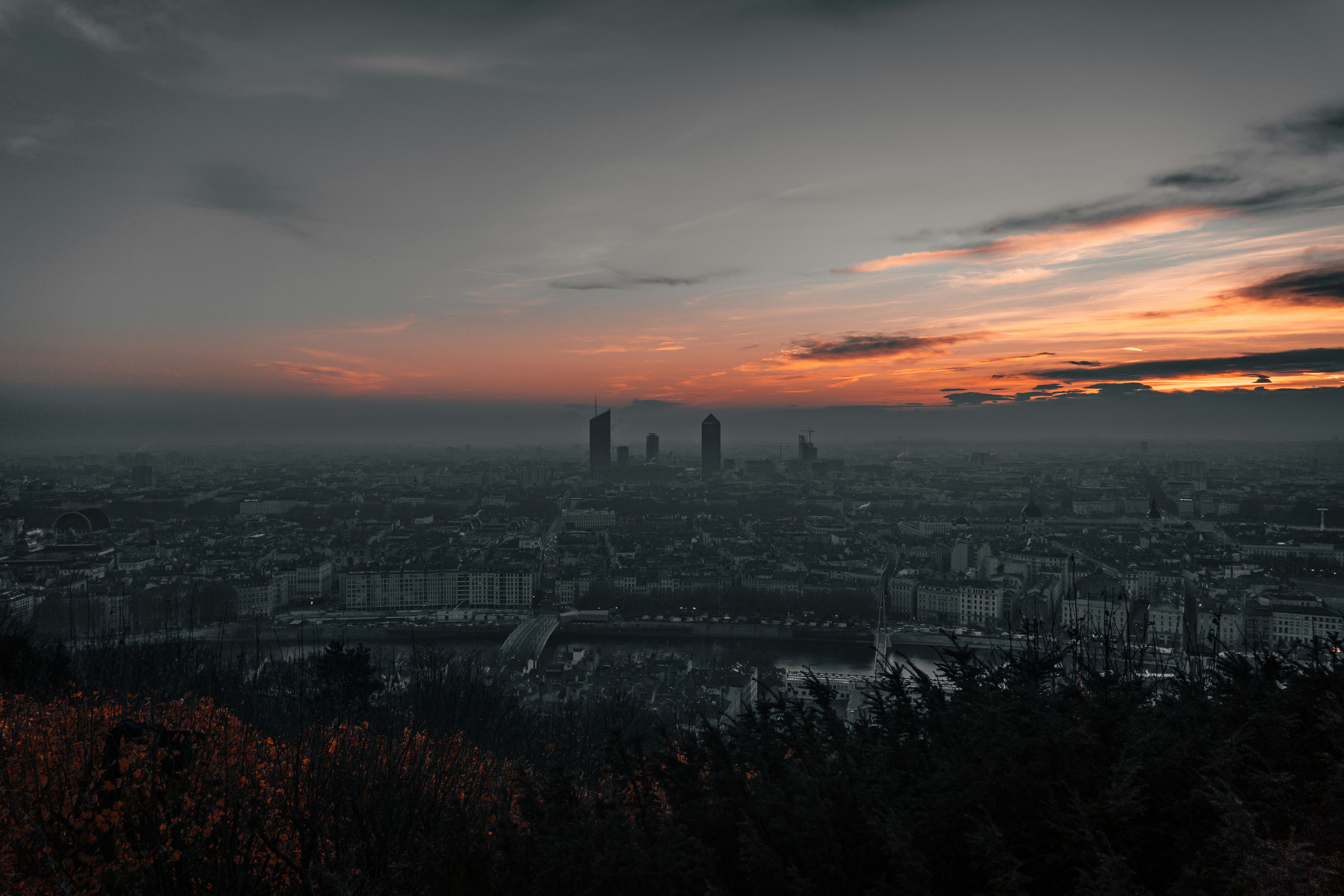 city skyline during sunset under cloudy sky