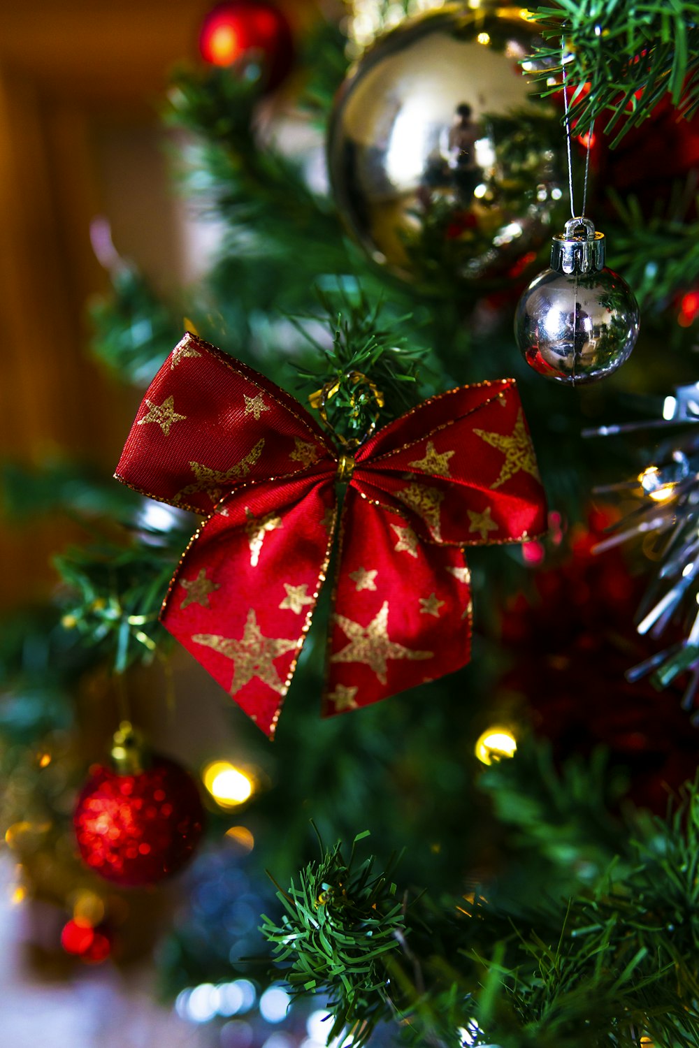 red and silver baubles on green christmas tree