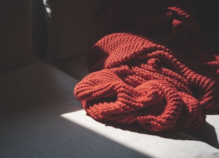 red knit textile on white table