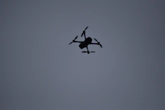 Close-up of the Archangel Wrath drone in flight against a dark sky.
