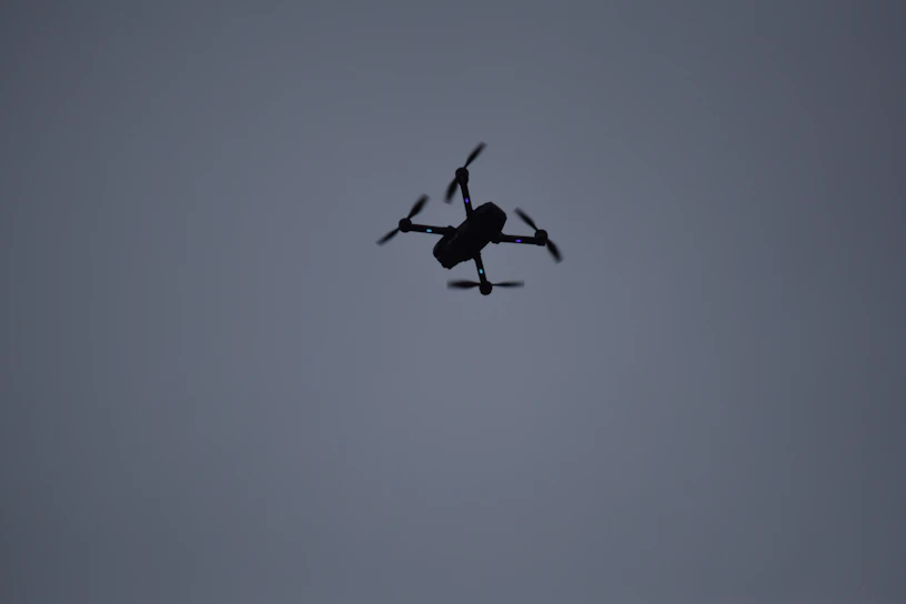 Close-up of the Archangel Wrath drone in flight against a dark sky.