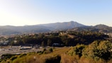 A scenic view of the rolling hills and rural landscapes along Route 1 in San José, Uruguay.