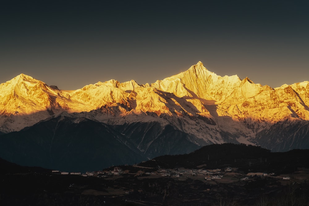 snow covered mountain during daytime