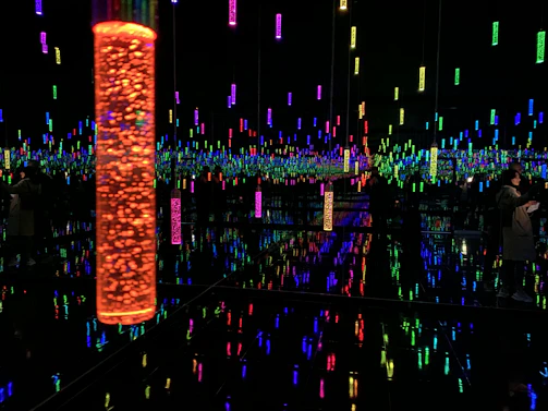 An immersive room filled with interactive light panels reacting to sound waves.