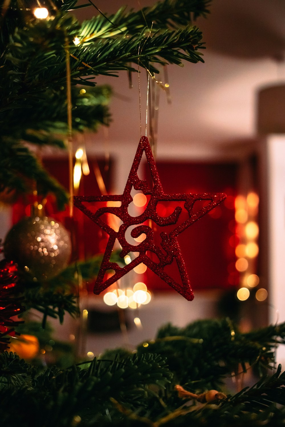 red and silver baubles on green christmas tree