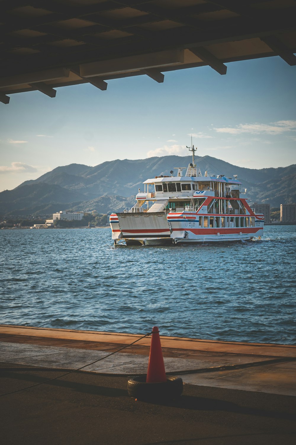 white and red boat on sea during daytime