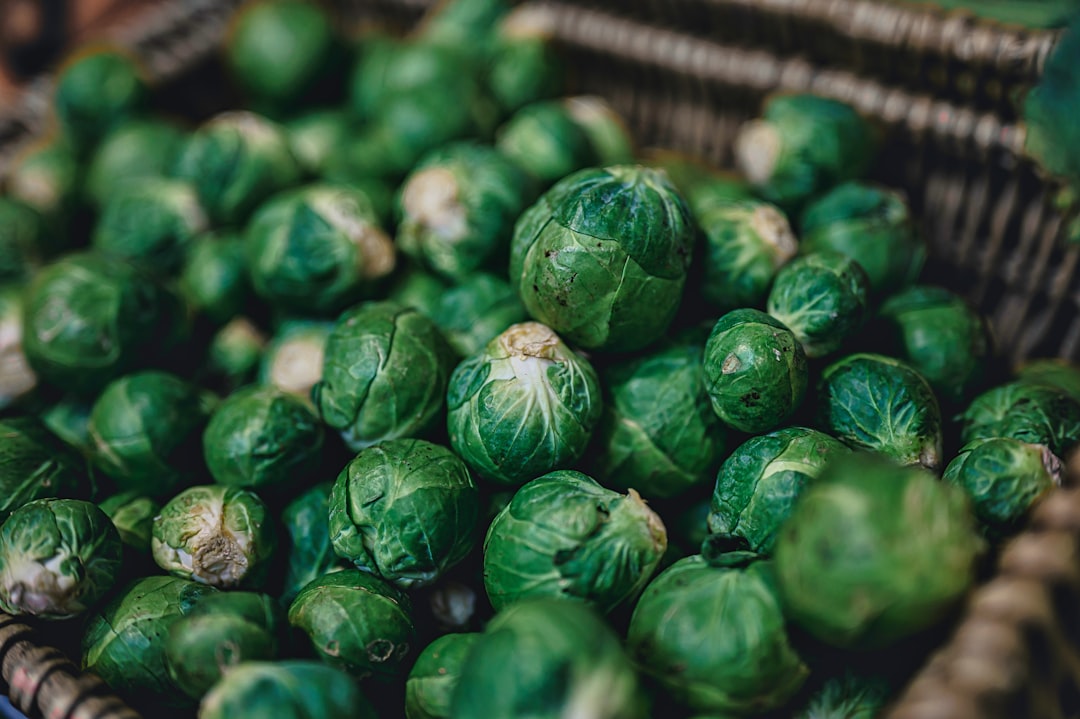 green leaves on brown woven basket, Brussel Sprouts