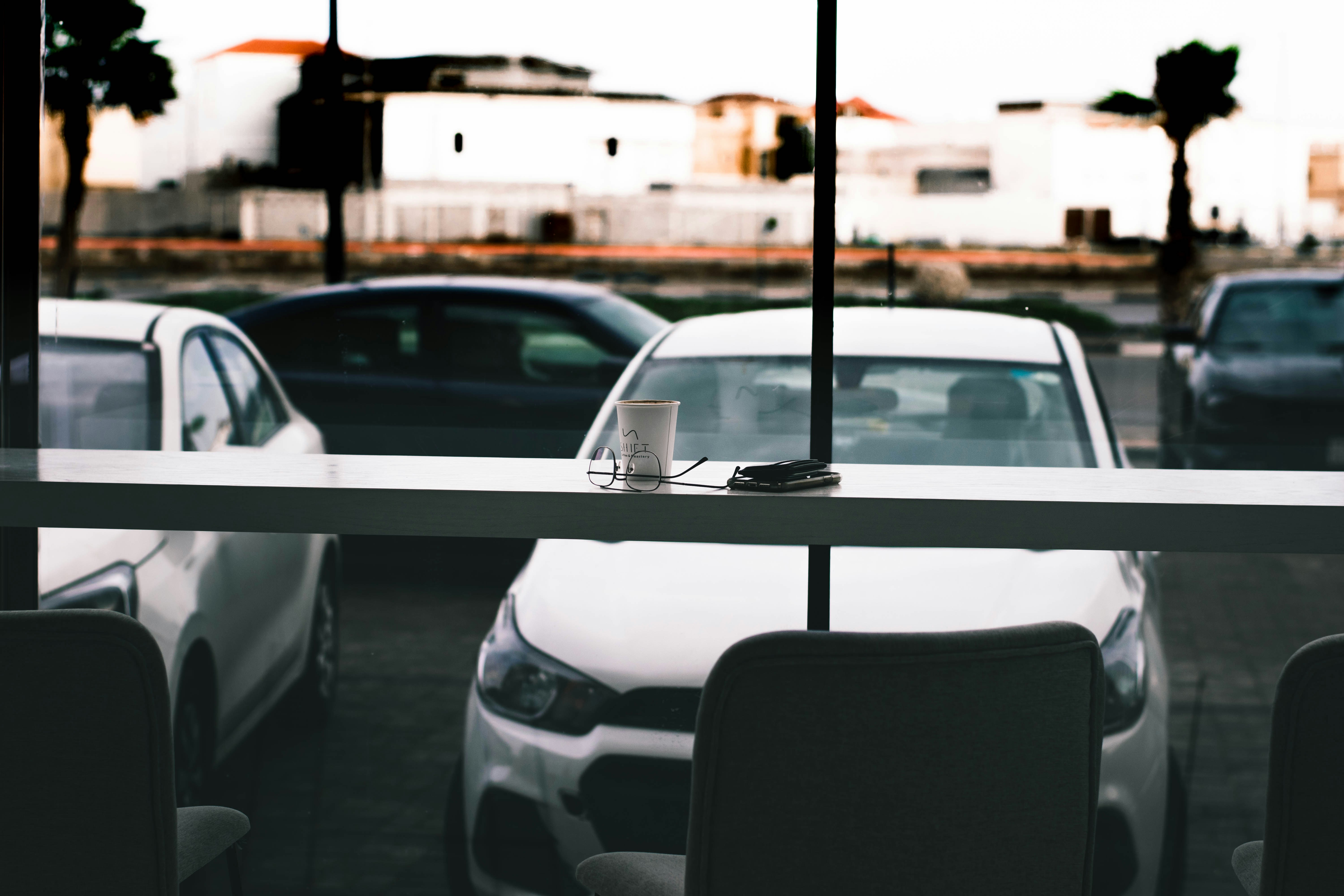 white car in front of black and white car