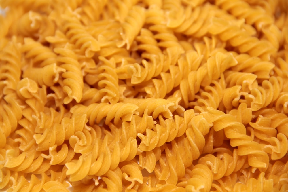 yellow pasta on black background