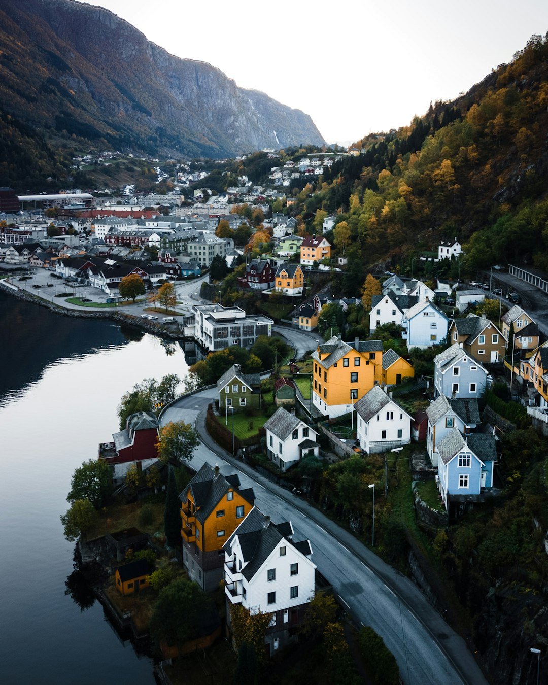 houses on mountain near river during daytime