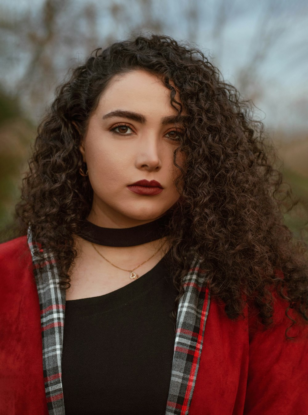 woman in black crew neck shirt and red cardigan