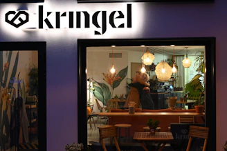 A cozy café scene where two people are smiling and sharing a moment, symbolizing the start of a meaningful connection.