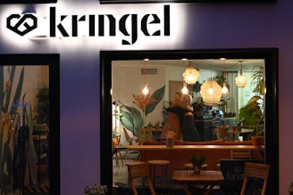 A warm, inviting coffee shop scene where a couple is sharing a genuine smile during their first date.