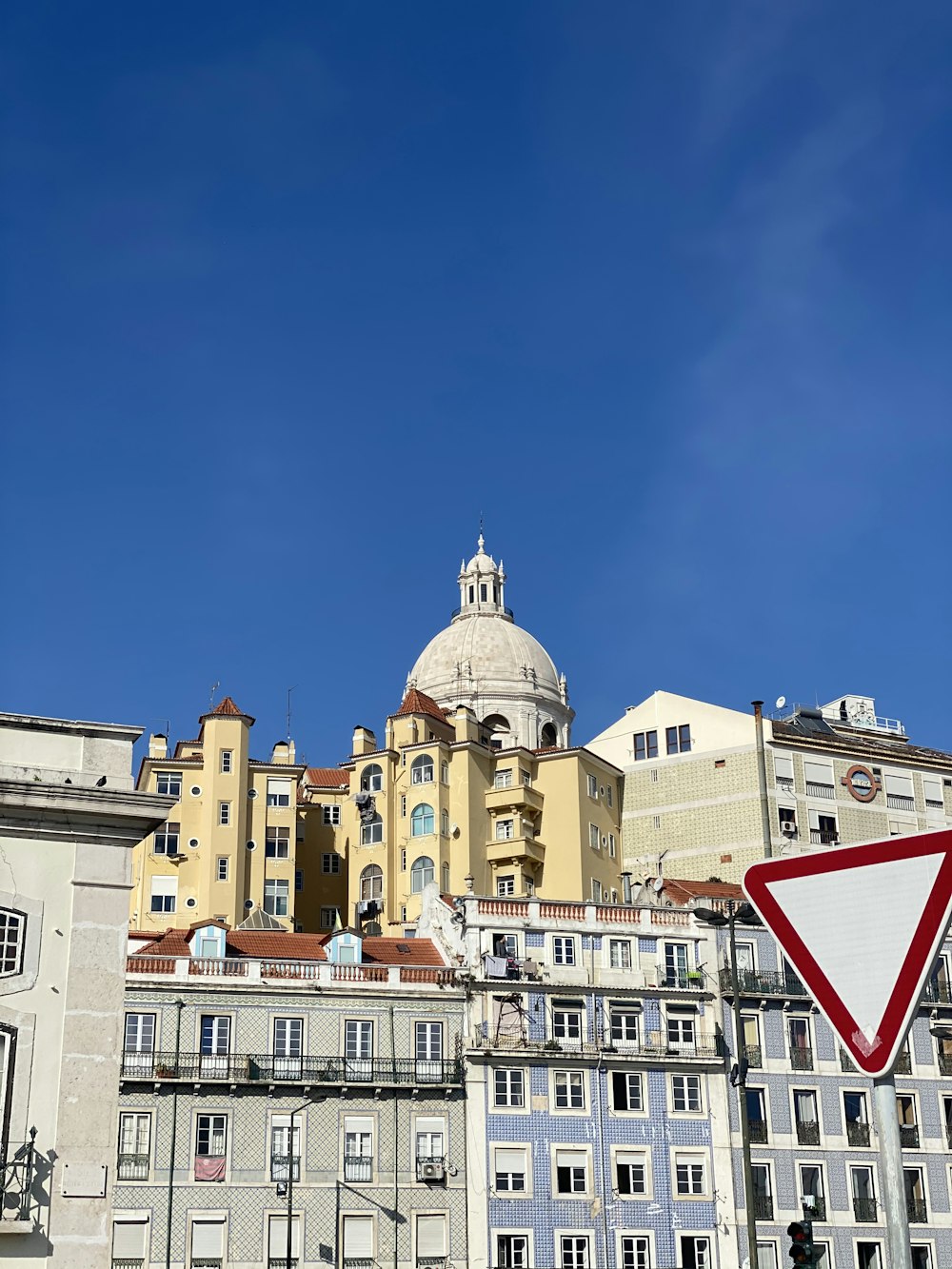 white and brown concrete building under blue sky during daytime