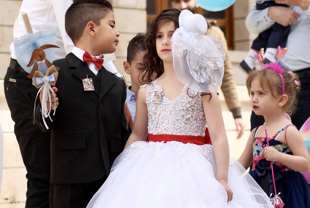 woman in white wedding gown holding bouquet of flowers