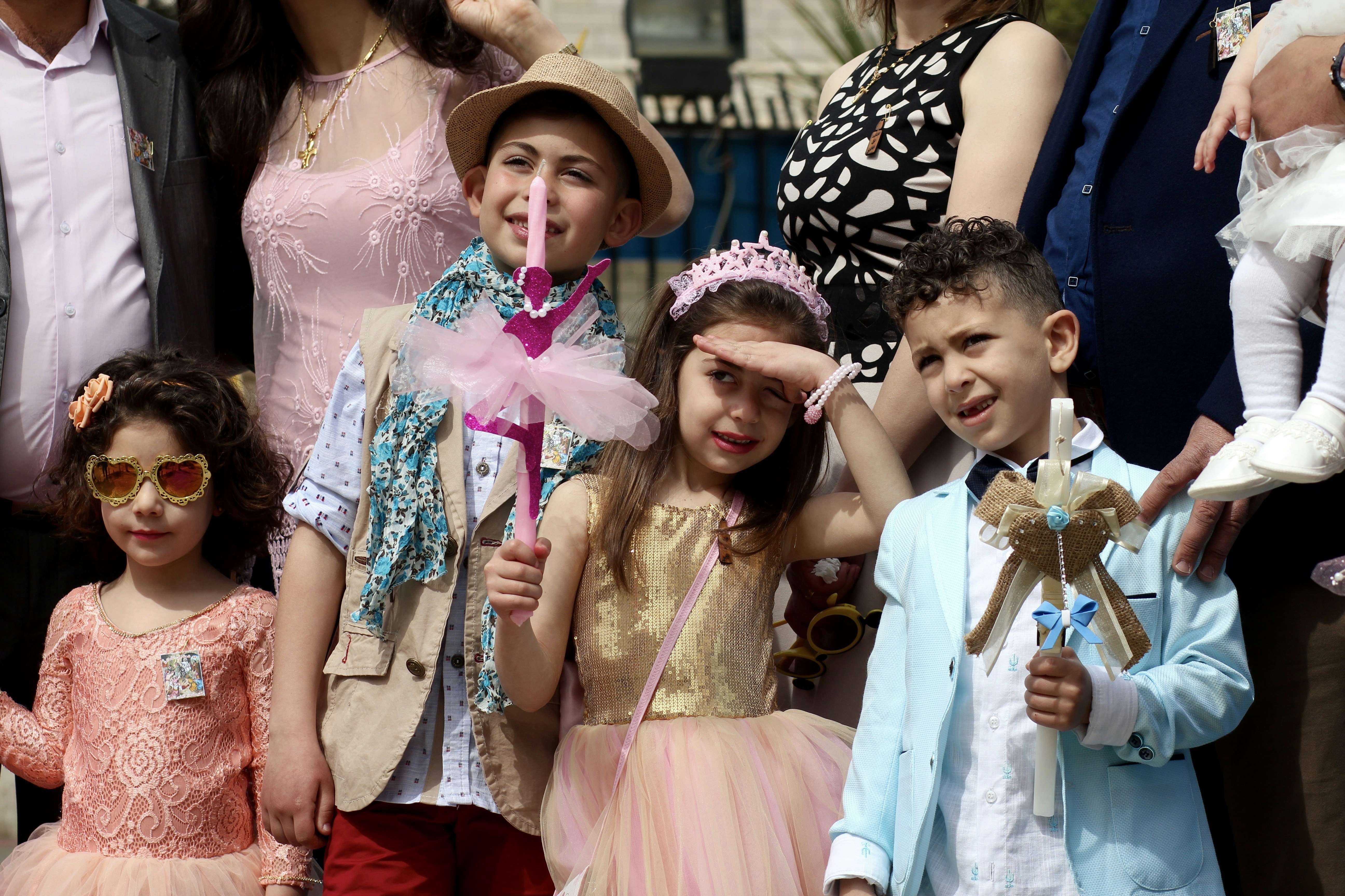 girl in white dress wearing black and white floral hat