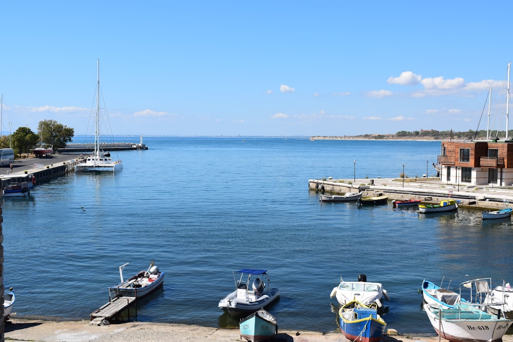 white and blue boat on sea during daytime