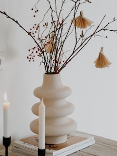 white ceramic vase with candles