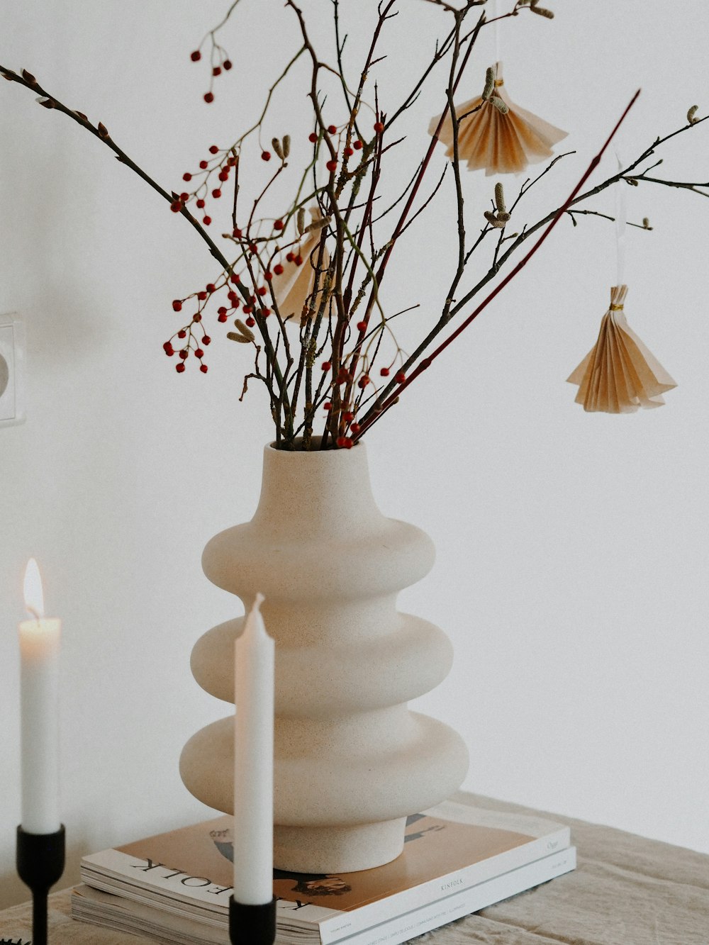 white ceramic vase with candles