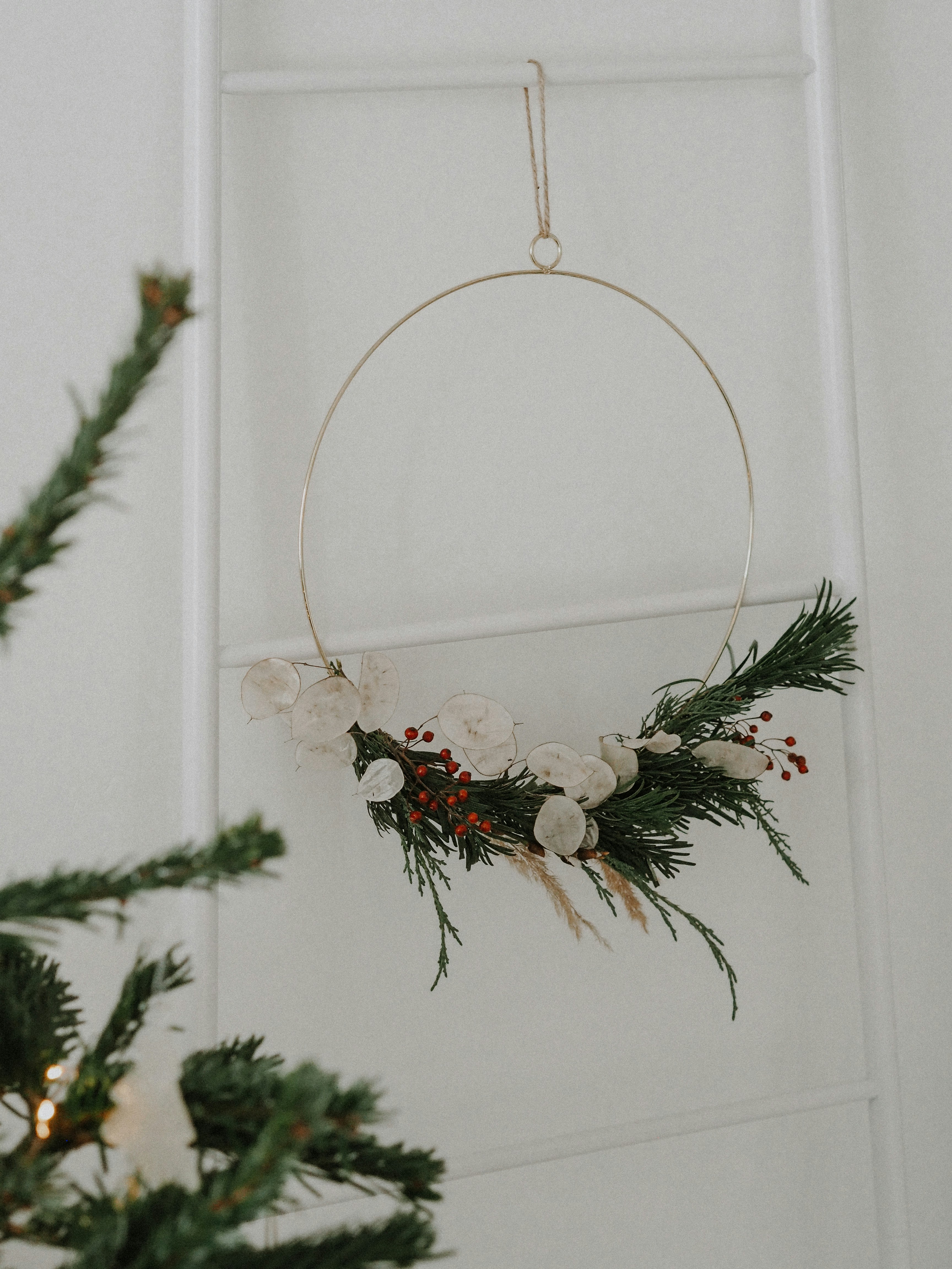 a christmas wreath hanging on a wall