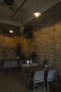 Cozy restaurant interior with minimalist design, warm lighting, and terracotta accents.