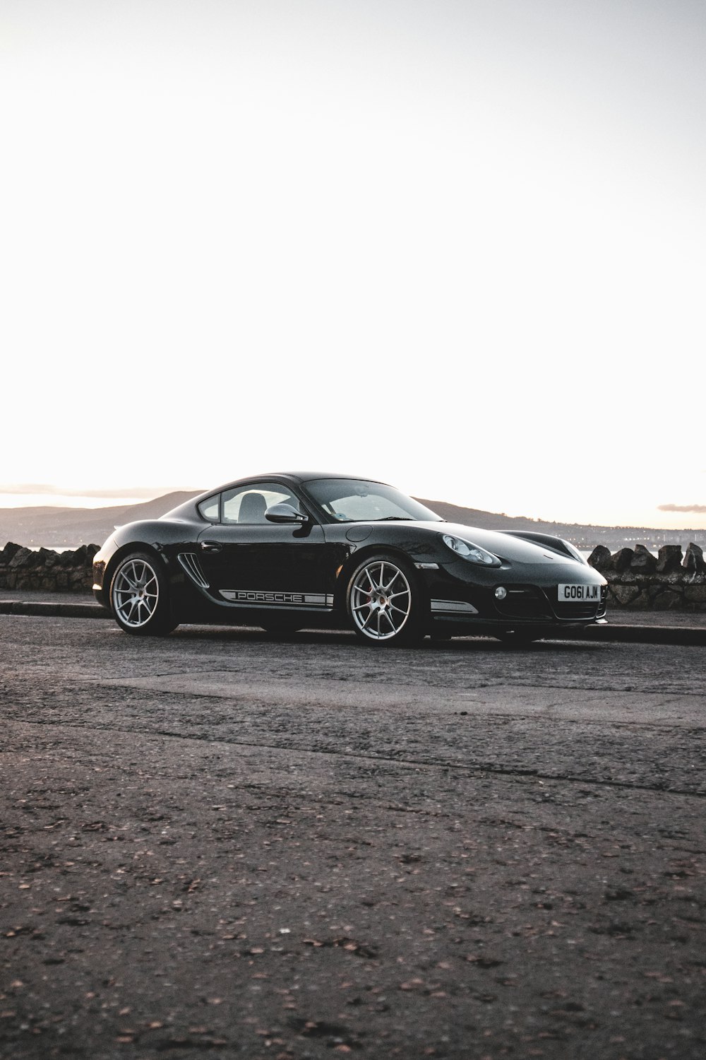 black porsche 911 on brown field