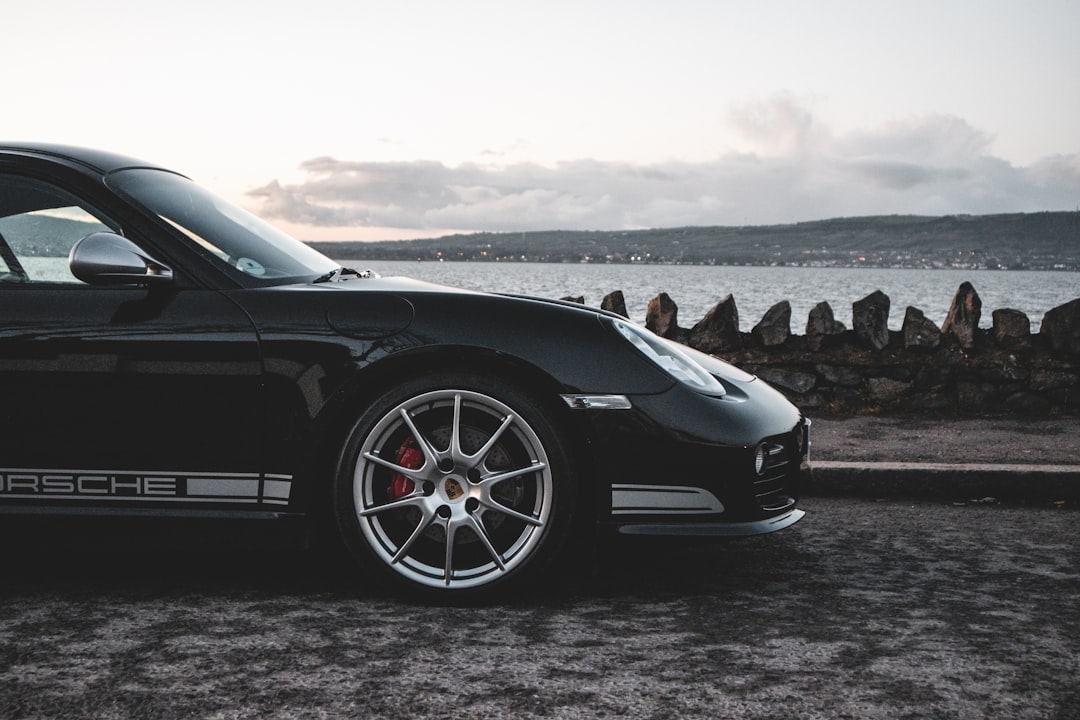 black car on gray asphalt road during daytime