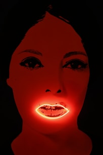 woman with red lipstick and yellow eyes