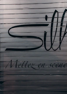 Detailed shot of anodized metal with crisp parchment-colored text overlay